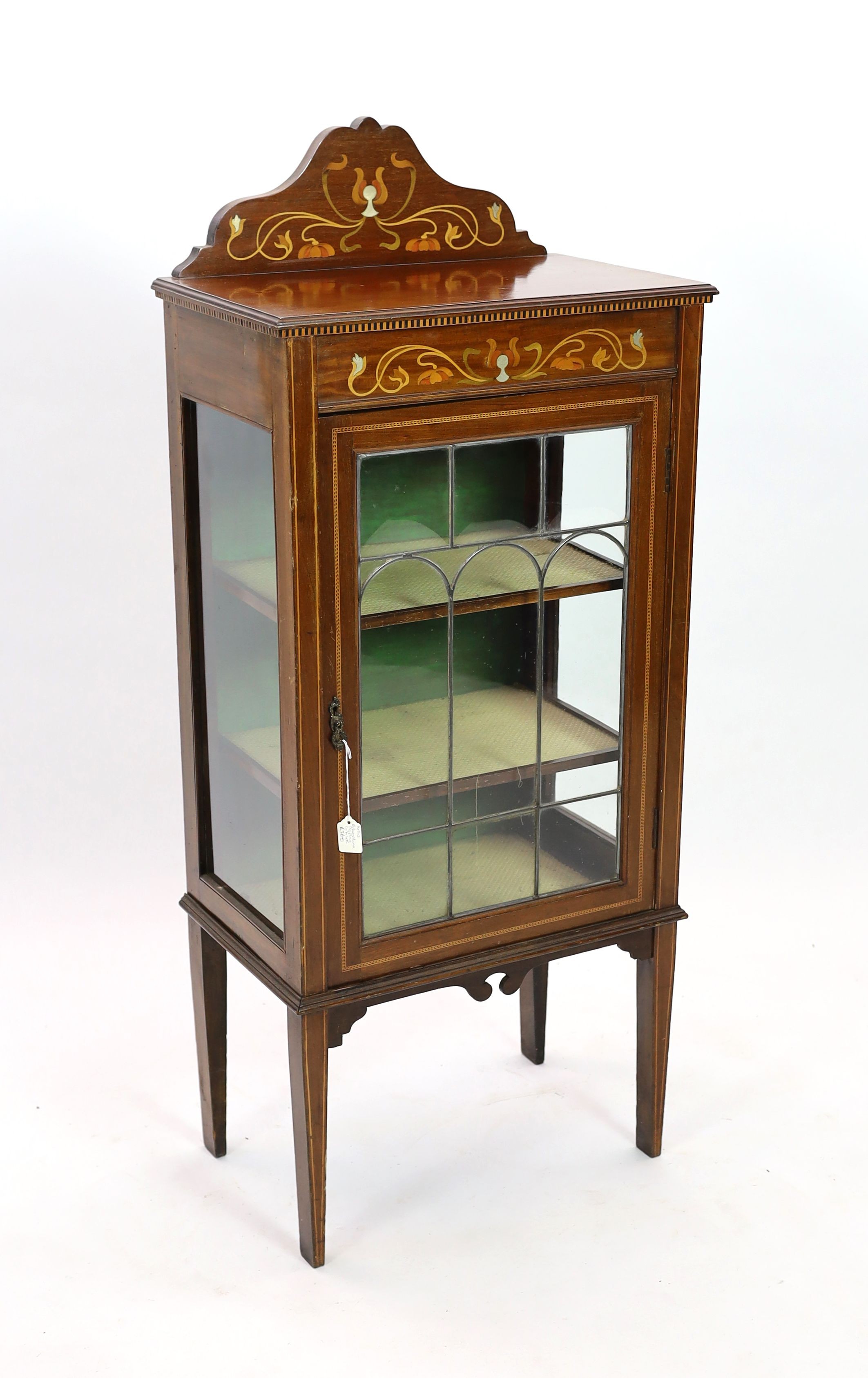 An Edwardian Art Nouveau inlaid mahogany display cabinet, with leaded glazed door, width 56cm depth 35cm height 132cm